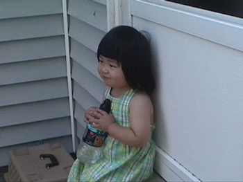 Raimi  sitting on steps of Scribner house.