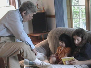 Nana showing Raimi and Abby her sock.